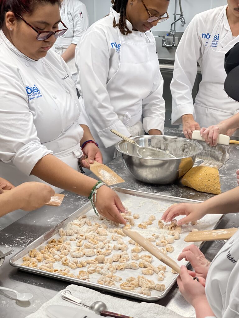 Culinary Arts students at Nossi College of Art & Design making handmade gnocchi during a workshop led by guest Chef Lorenzo from Italy.