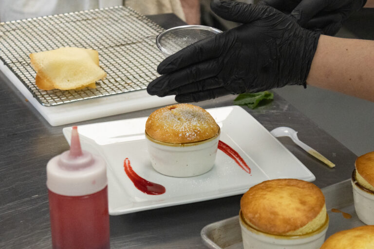 Golden soufflé fresh from the oven, prepared by Culinary Arts student.