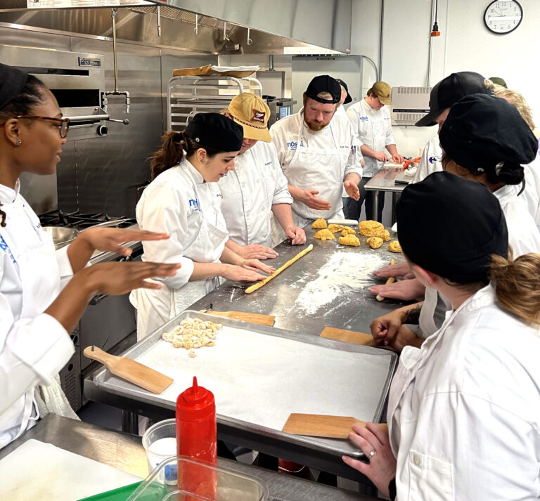 Chef Lorenzo guiding Culinary Arts students through team exercise.