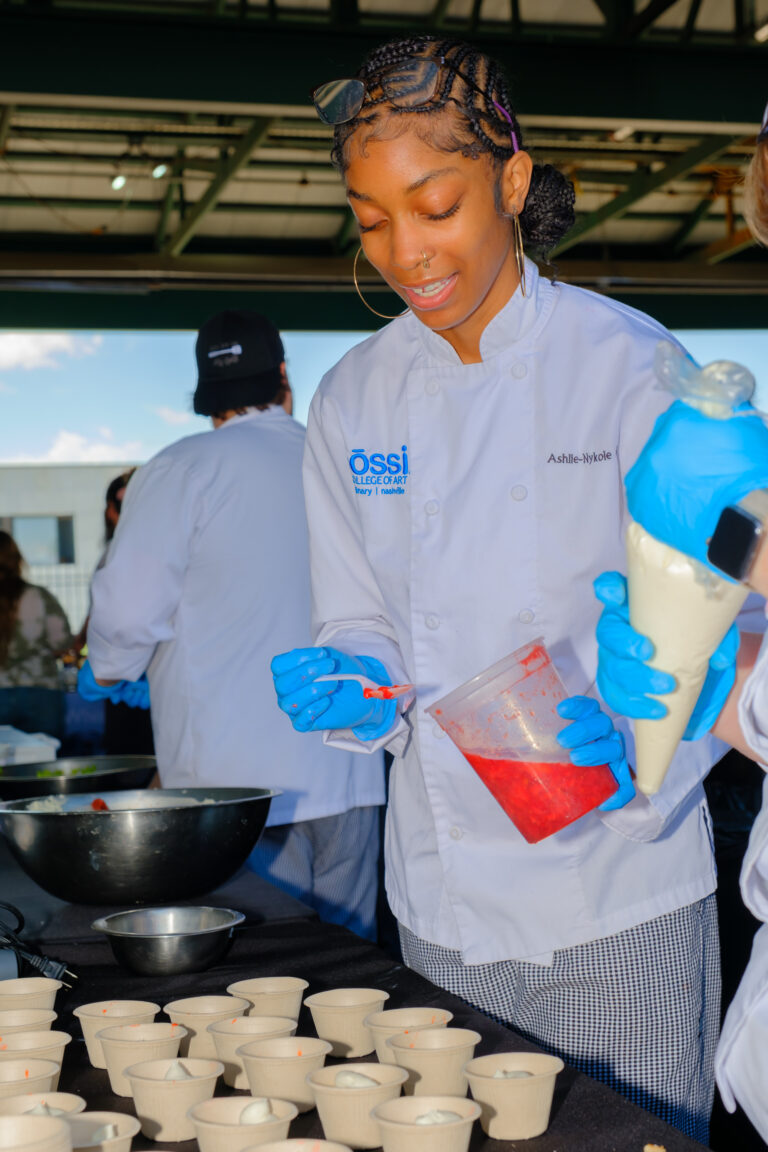 Student creating pastries during Culinary Arts lab.