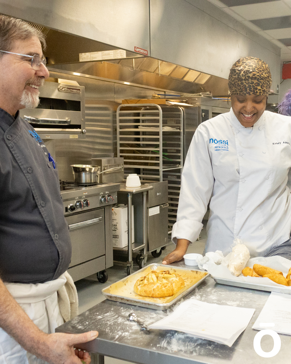 Chef Anthony working with student in the kitchen