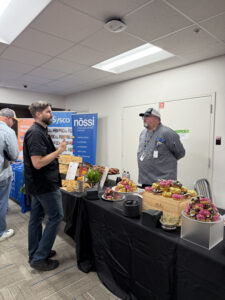 68e003cda679310005567988 Chef training Nashville students at Sysco Holiday Food Show with Chef Russell Ransom