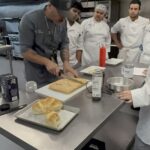 IMG_2572 Chef Zac demonstrating how to plat focaccia for the class.