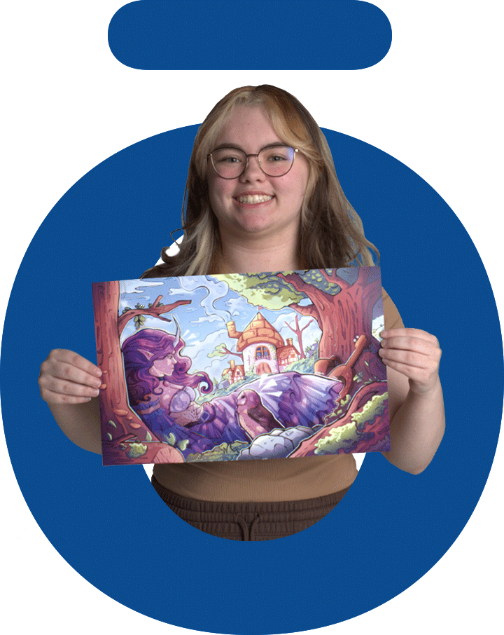 Illustration Technologies student at Nossi College proudly holding a colorful fantasy illustration created for a class project.